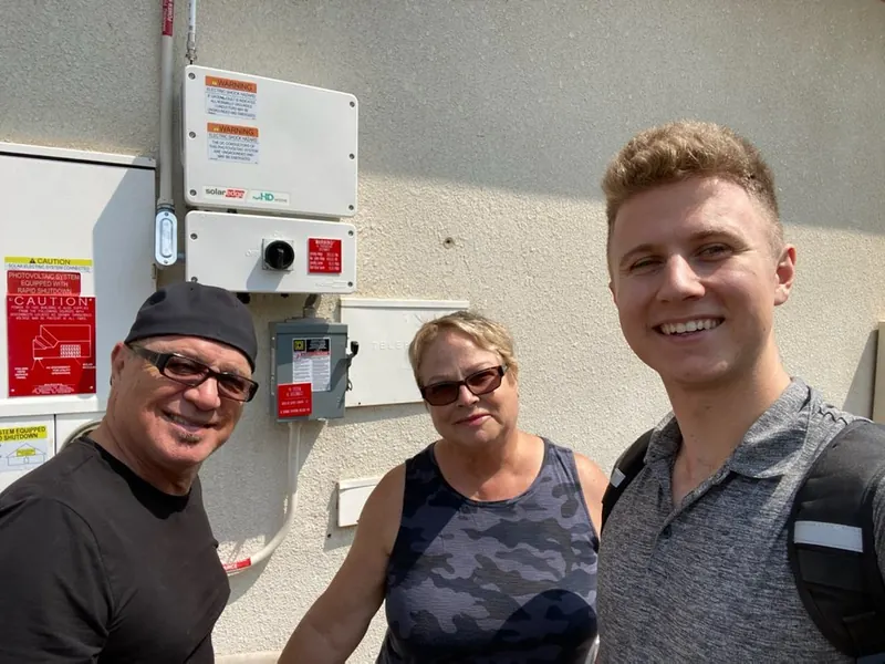 Conner with Deb F after their solar installation