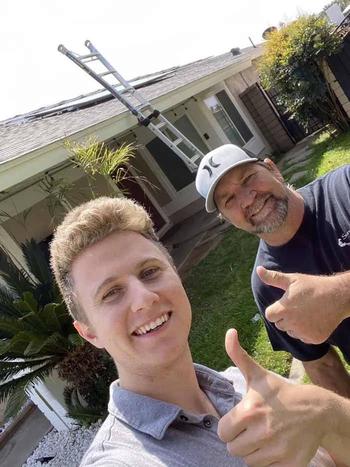 Conner with John W after their solar installation