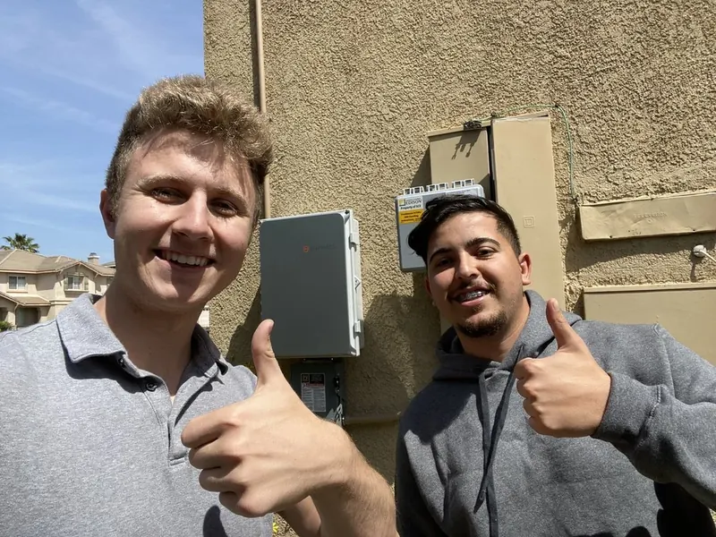 Conner with Selim H after their solar installation